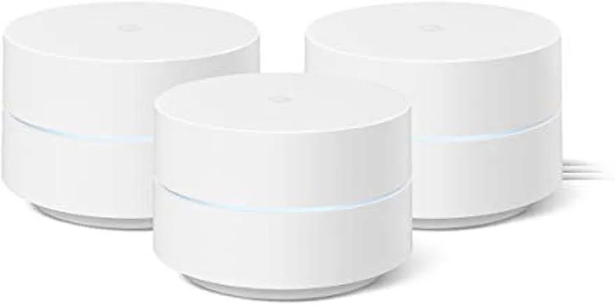 Three Google WiFi mesh access points clustered together